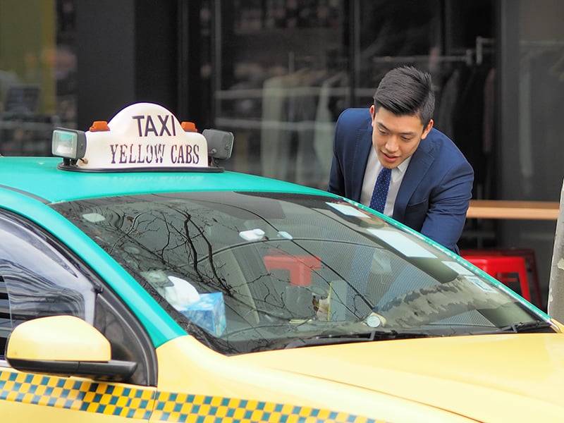 ANZ graduate commuting to work by taxi