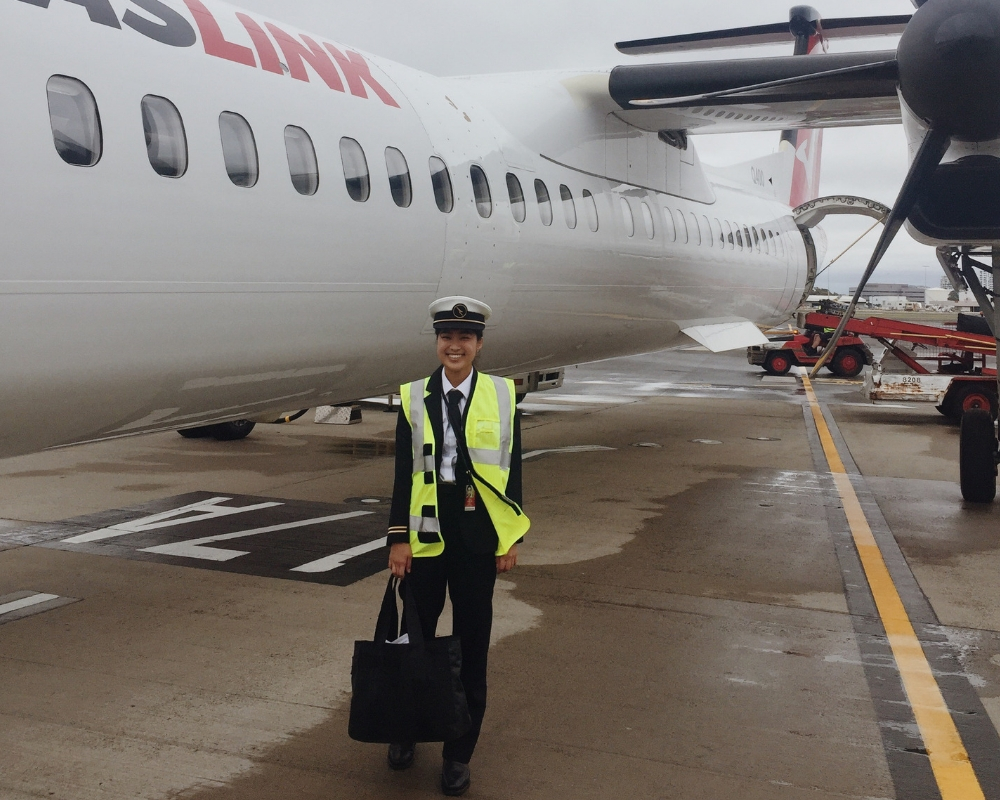 Lena beside the Qantas aircraft