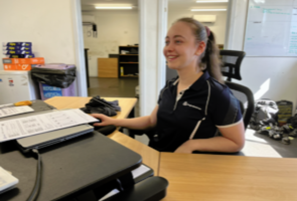 Anglo American Isabell working on her desk