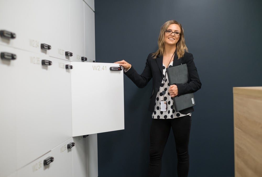 Australian National Audit Office (ANAO) Graduate - Young female professional opening her locker.