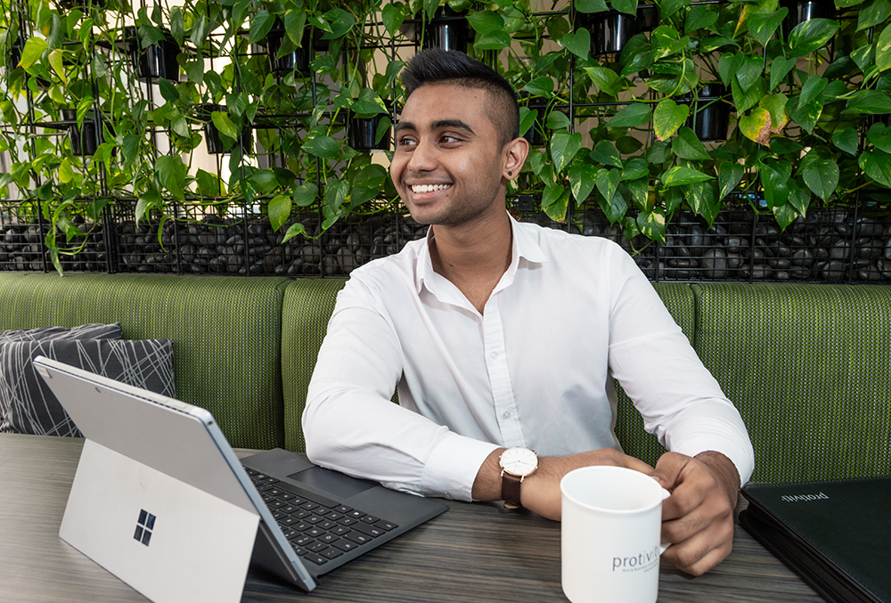 Protiviti Graduate - Mihir Kothapallyn with a cup of coffee