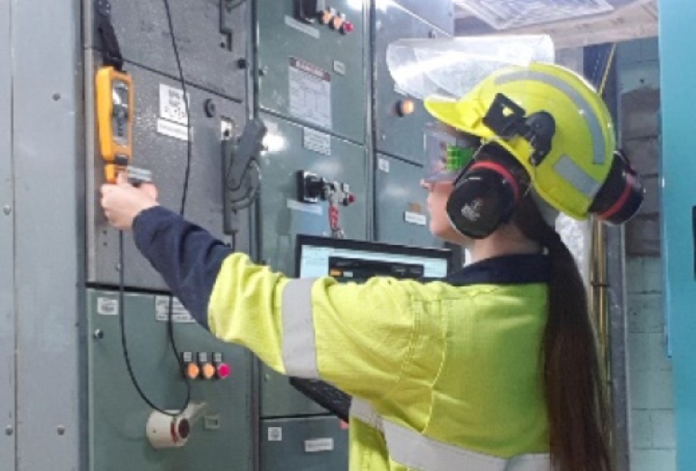 Alcoa of Australia Graduate - Young female professional working on a electric circuit.