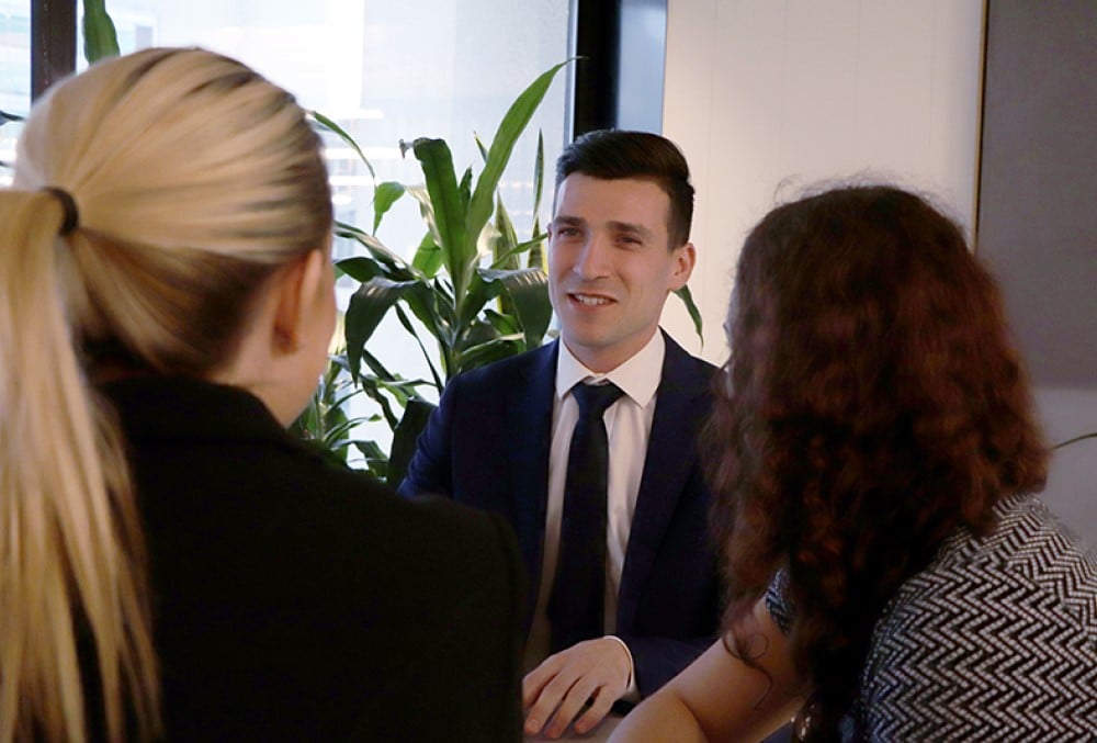 Sparke Helmore Lawyers Graduate - Young male lawyer on a meeting with a client and his senior associate.