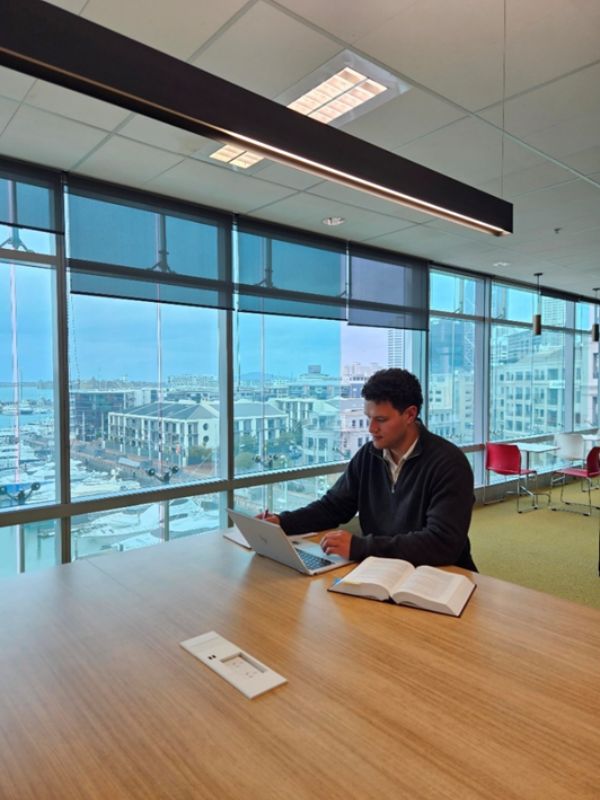 Dentons New Zealand - Jackson Tu’inukuafe working in the office