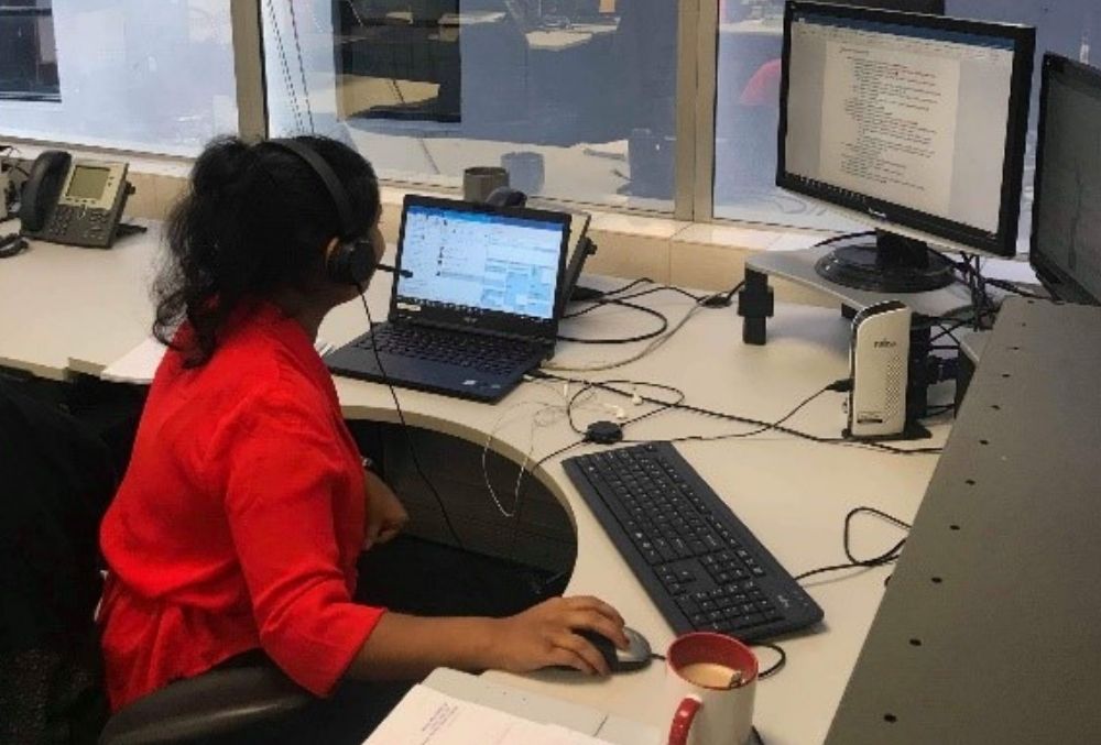 Deepikah working on a presentation on her desk