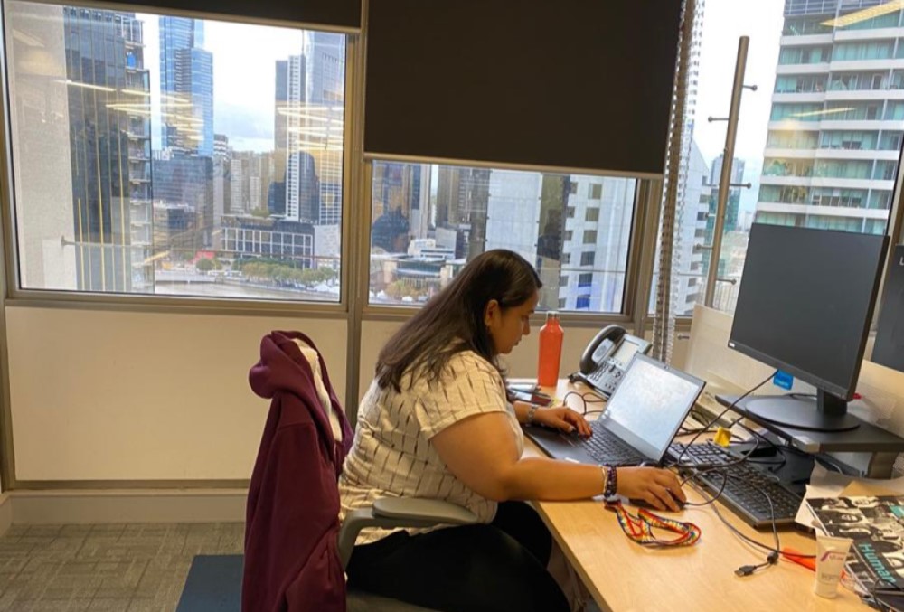 Capgemini Australia Graduate - Female professional working on her desk.