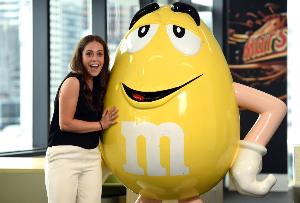 Laura posing with M&M