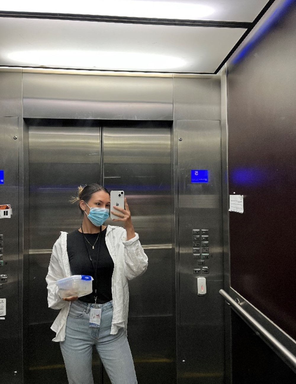 Hamilton City Council Graduate - Young professional standing inside the elevator.