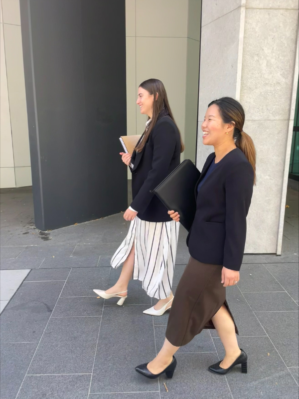 Walking with her colleague going to the court