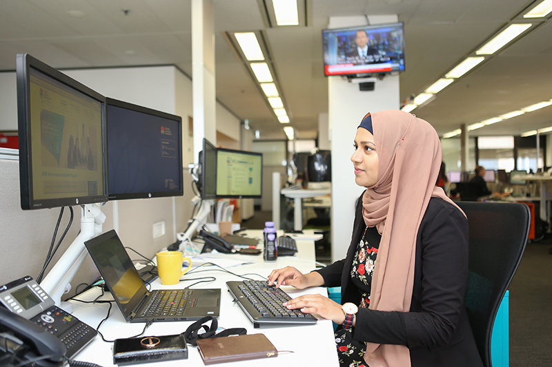 Day in the Life_NSW Government_Rabab Hannan8_800x600 2017 at her desk