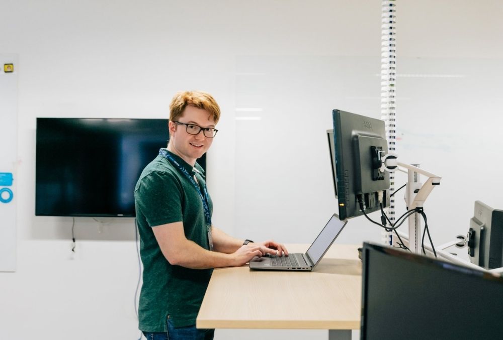 XERO - Benedict Gattas standing on his desk