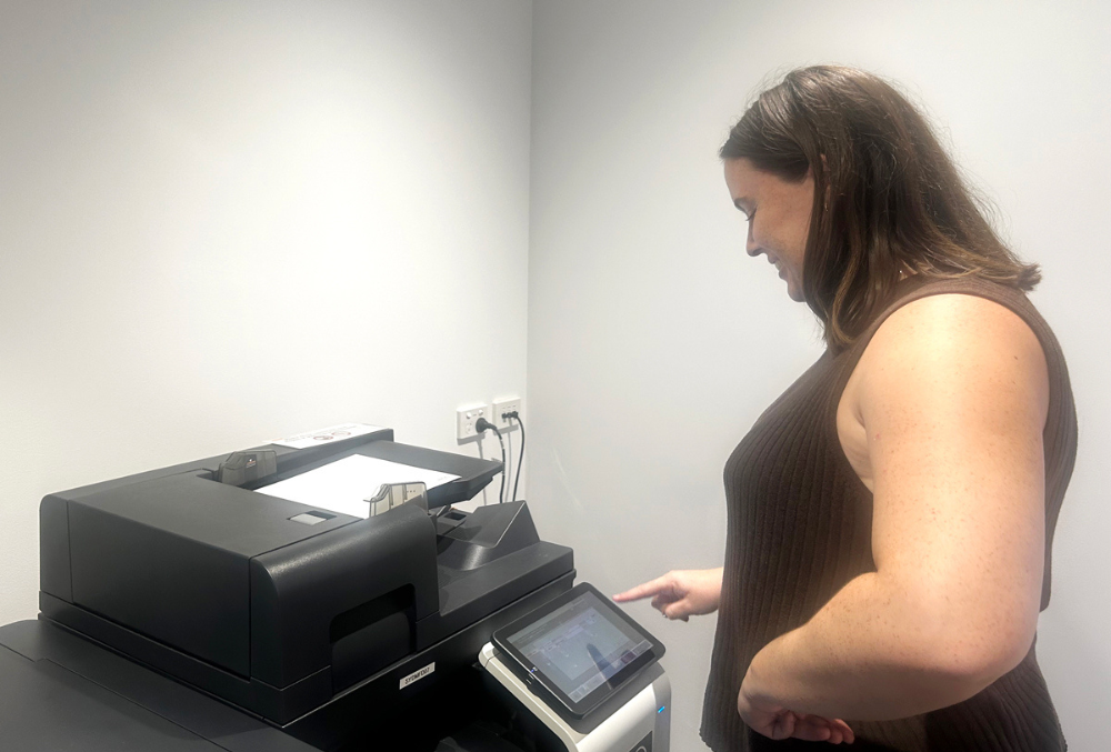 Abigail beside the printer