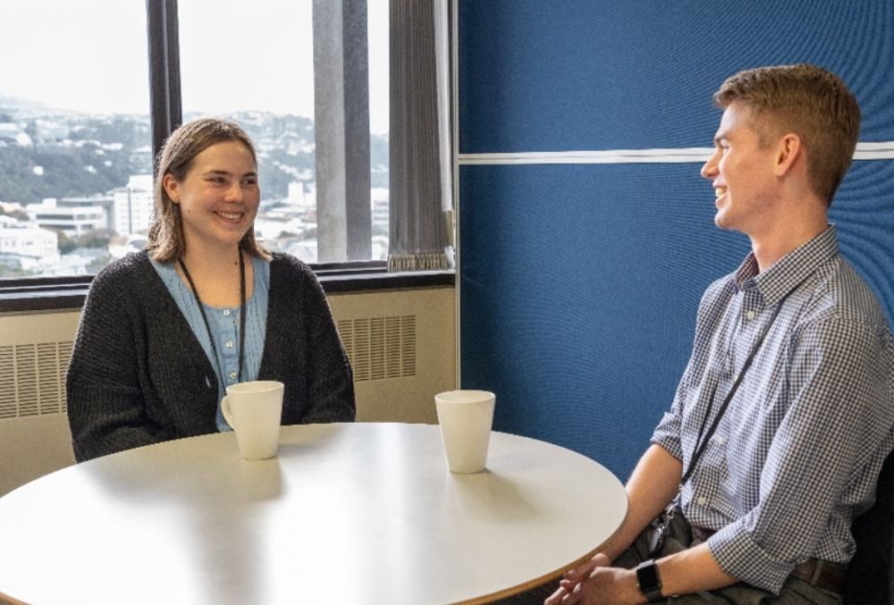 Inland revenue Rory talking with his colleague 