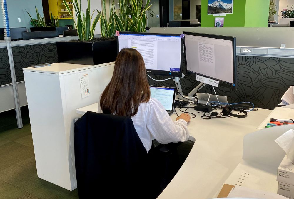 Financial Markets Authority - Sharon Louie working on the desk