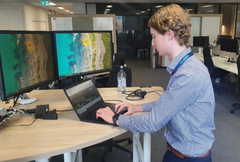 racv tom mahon working on his work station