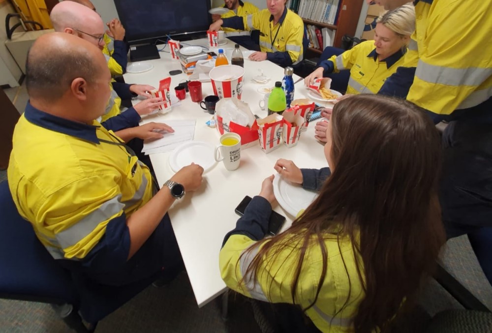 Alcoa of Australia Graduate - Young female professional having lunch with her teammates.